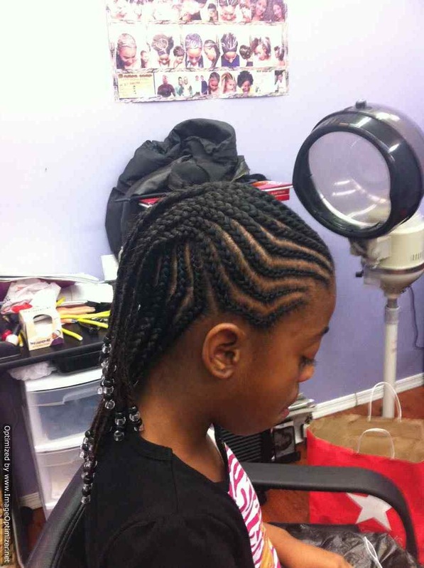Side view of child cornrows